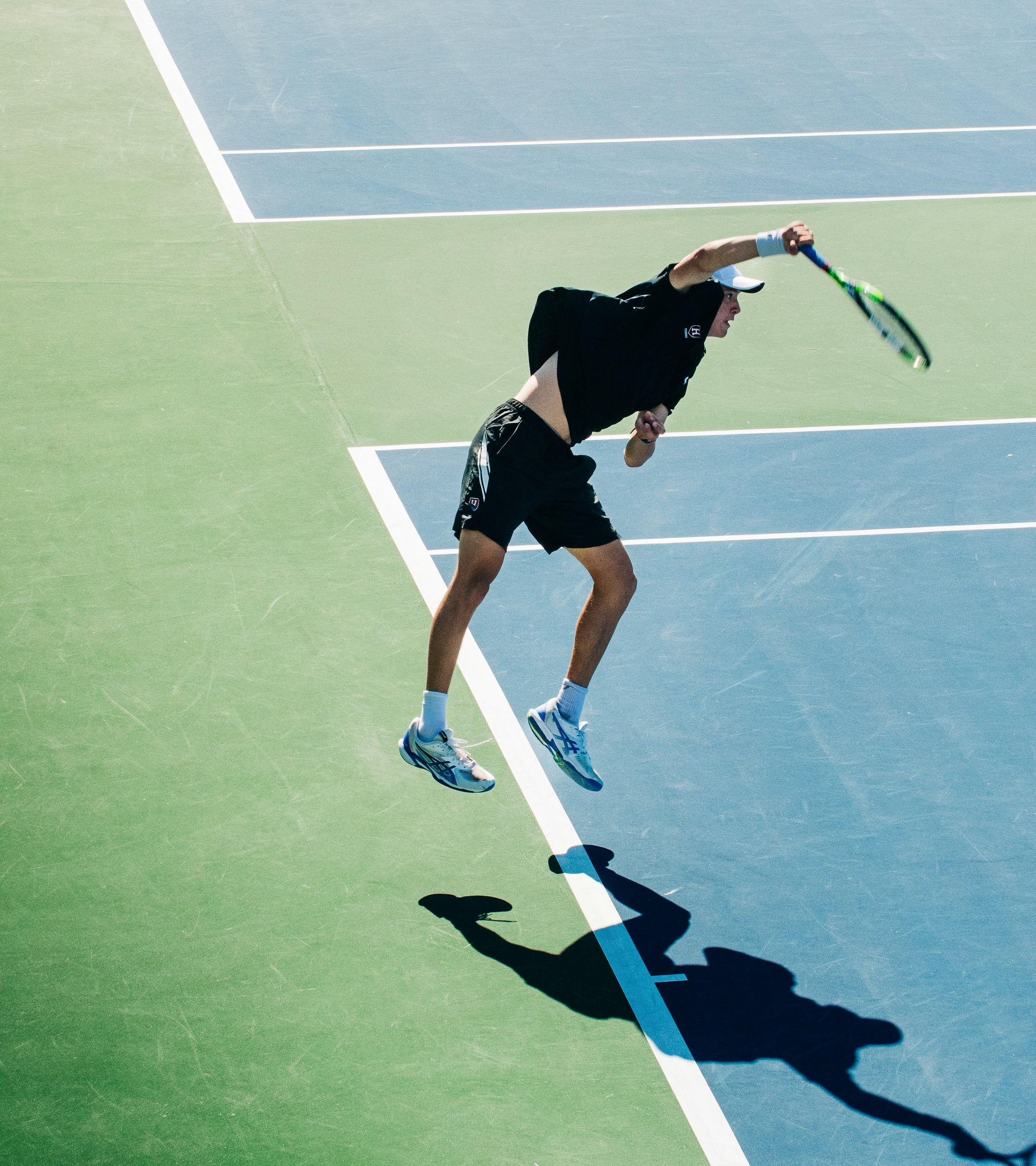 Tennis player in action on a tennis court